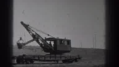 California USA (1936): A Man In A Crane Is Moving Dirt And Dumping It