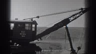 California USA (1936): Worker Push A Wagon On Rail To Build The Railway In A Empty