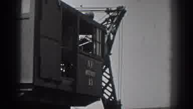 California USA (1936): A Man Operates A Crane To Dig Dirt From A Field