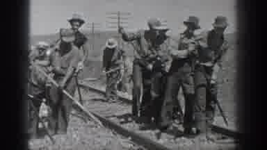 California USA (1936): Men Working On The Train Rails In The Middle Of The Desert