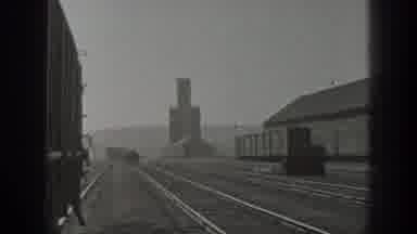 California USA (1936): People Riding On A Industrial Train Car