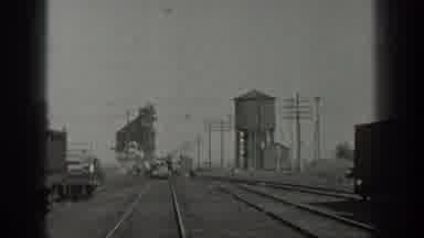 California USA (1936): Rail car On Train Tracks Being Moved By People To