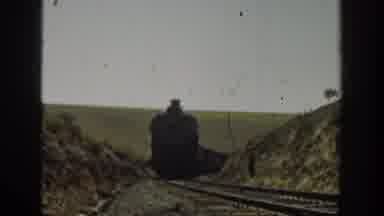 California USA (1936): One Person Capturing The Train Moving In The Train Track