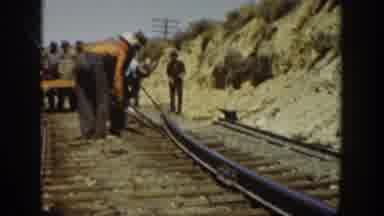 California USA (1936): Men Working Diligently Ripping Up A Rail In The Hot Sun