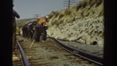 California USA (1936): Men Working Own A Railroad And Fixing The Tracks And
