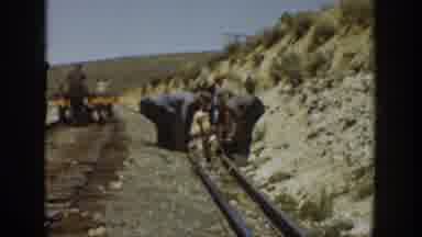 California USA (1936): Group Of Men Lifting Building A Railroad Rail Track Line