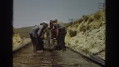 California USA (1936): Men Working Together To Carry Something Heavy,