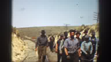 California USA (1936): Group Of Men Working On The Railroad, Carrying Rails And