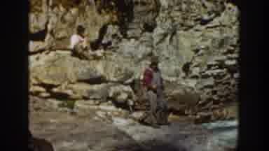 California USA (1936): Man Fishing On The Beach Next To Cliffs In Cheerful Sunny