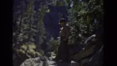 California USA (1936): Men Fly Fish From Rocks Along A Mountain Stream With A