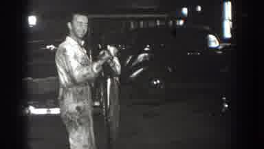 California USA (1936): Men In A Garage Holding A Weird Object And An Open Land