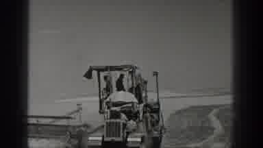 California USA (1936): Man Drives Tractor On Field Farm Work Farm Hand Helpers
