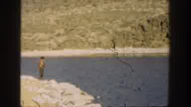 California USA (1936): Man Swimming In A River Back And Forward In Desert Like