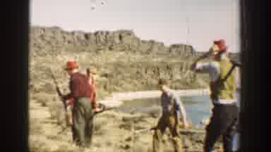 California USA (1936): Four Men With Hat And Long Rifles Practice Marching While