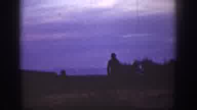 California USA (1936): Someone Walking Through A Grassy Field In The Dark