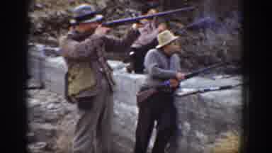 California USA (1936): Four People Shooting Long Rifles Near Concrete Wall Range