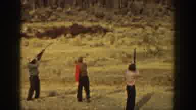 California USA (1936): Men Practicing Target Shooting In Open Area With Assistant