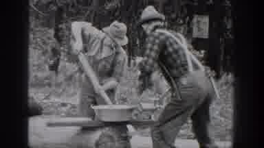 Chelan Washington USA (1939): Two Men Preparing To Use Outdoor Grinder Sitting On