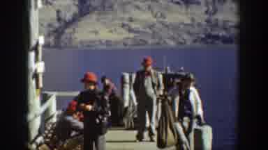 Chelan Washington USA (1939): People On A Dock Passing Time Smoking And Walking