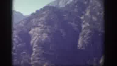 Chelan Washington USA (1939): Creepy Man Hat Blue Skies Many Mountains Clear Quick