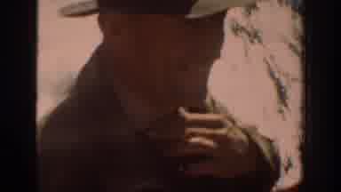 Chelan Washington USA (1939): Cowboy Looks Upon Mountain Scenery And Rubs Chin In