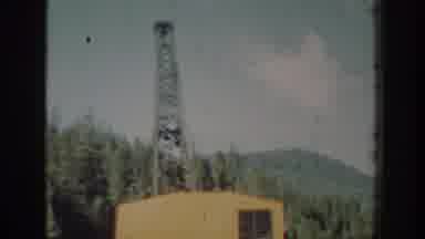 Chelan Washington USA (1939): Operator In A Large Yellow Crane Skillfully Swinging