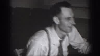 CHELAN WASHINGTON USA-1939: Two Men Talk In The Room