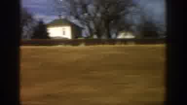 Aspen Colorado USA (1961): Passing View Of Mountain Lake And Red Barns Along Road