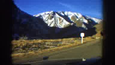 Aspen Colorado USA (1961): Looking Out Windshield Of Vehicle, Snow On Mountains