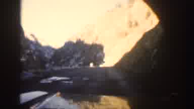 Aspen Colorado USA (1961): A Vehicle Travels Down A Rough Road In The Mountains