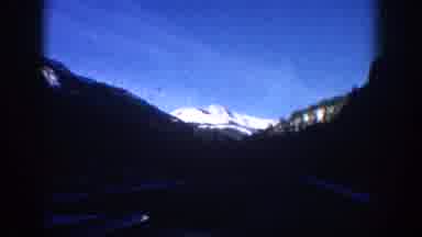 Aspen Colorado USA (1961): Driving Up To Large Snowy Mountains And Woods