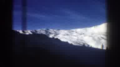 Aspen Colorado USA (1961): Traveling Down The Snowy Mountain Side In A Car On A