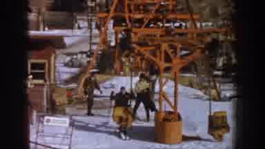 Aspen Colorado USA (1961): Man On Swing At Winter Ski Resort