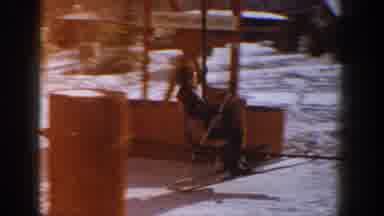 Aspen Colorado USA (1961): A Person Gets On A Ski Lift And Another Also Gets On