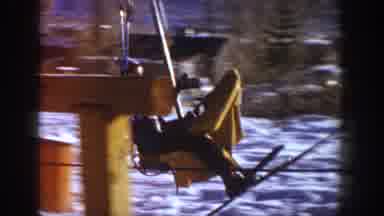 Aspen Colorado USA (1961): Young Woman Exiting Ski Lift Onto Packed Snow As