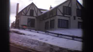 Aspen Colorado USA (1961): Shows A Large Home While Driving Down A Road In A Snowy