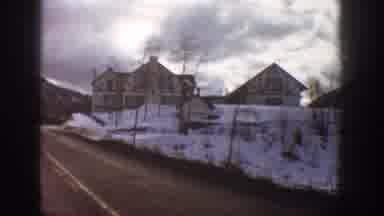 Aspen Colorado USA (1961): Driving On Clear Roads Through A Snowy Mountain Village