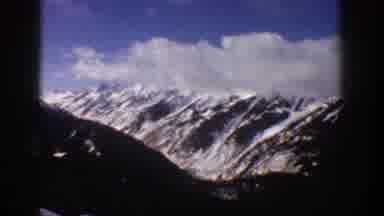 Aspen Colorado USA (1961): Sky View On Top Of A Large Snowy Mountain With Clouds