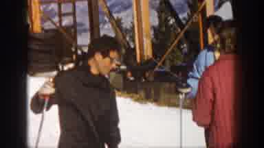 Aspen Colorado USA (1961): Man Speaks To Man And Woman While Holding Ski Poles