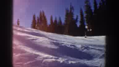 Aspen Colorado USA (1961): Three People Skiing During Winter And Down A Small
