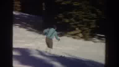 Aspen Colorado USA (1961): Two Men Skiing Downhill On A Bright Sunny Winter Day