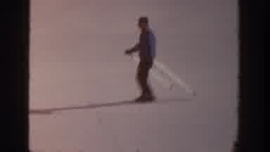 Aspen Colorado USA (1961): Group Of People Skiing Down A Snowy Mountain Side