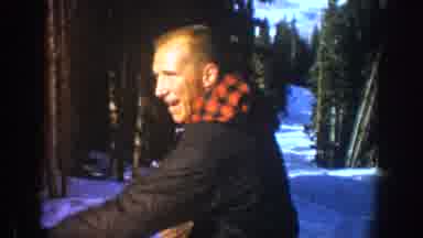 Aspen Colorado USA (1961): A Man Is Skiing On A Slope Jumps Over A Ditch Landing