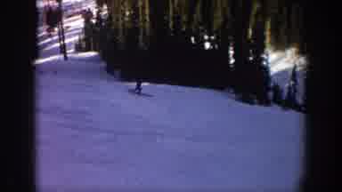 Aspen Colorado USA (1961): Person Skiing Down A Slope With Someone Else Watching
