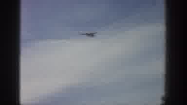 Aspen Colorado USA (1961): A Man Was Skating In The Snow And Flying In A Airplane