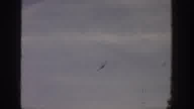 Aspen Colorado USA (1961): A Bird And An Airplane Is Flying On The Sky It's So