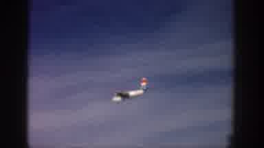 Aspen Colorado USA (1961): A Commercial Plane Passing Through The Blue Sky Before