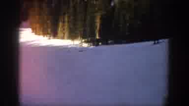 Aspen Colorado USA (1961): A Man Is Skiing Down A Hill In The Snow Fairly Fast
