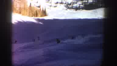 Aspen Colorado USA (1961): Snowboarding Down A Steep Slope On A Sunny Day Beside A