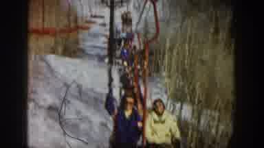 Aspen Colorado USA (1961): Two People Are Riding A Snow Lift Getting Ready To Go